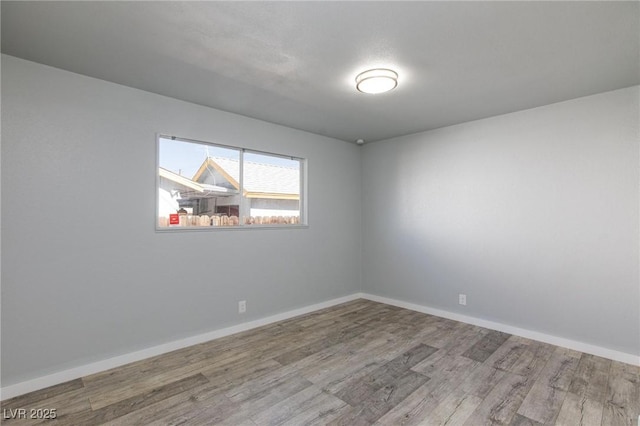 6317 Alta Dr, Las Vegas, NV 89107 - unfurnished room featuring wood finished floors and baseboards