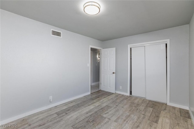 6317 Alta Dr, Las Vegas, NV 89107 - unfurnished bedroom featuring wood finished floors and a closet