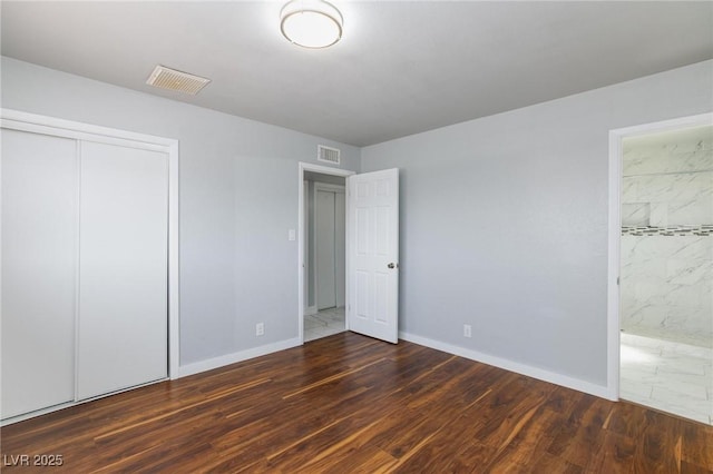 6317 Alta Dr, Las Vegas, NV 89107 - unfurnished bedroom featuring wood finished floors, a closet, and ensuite bath