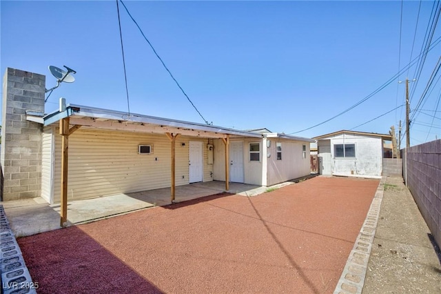 6317 Alta Dr, Las Vegas, NV 89107 - back of house featuring a fenced backyard and a patio area
