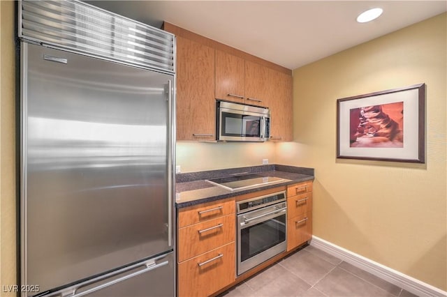 2000 Fashion Show Dr Unit 4105-4106, Las Vegas, NV 89109 - kitchen with appliances with stainless steel finishes, brown cabinets, light tile patterned floors, and recessed lighting