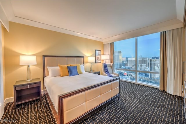 2000 Fashion Show Dr Unit 4105-4106, Las Vegas, NV 89109 - bedroom featuring brick patterned floors, a view of city, and a wall of windows