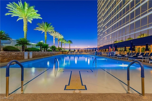 2000 Fashion Show Dr Unit 4105-4106, Las Vegas, NV 89109 - pool at dusk with a community pool