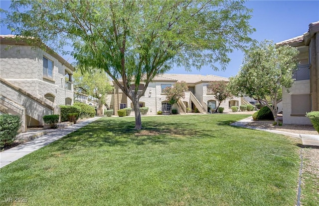 5112 Harvest Time St Unit 201, Las Vegas, NV 89130 - view of community featuring a lawn, a residential view, and stairway