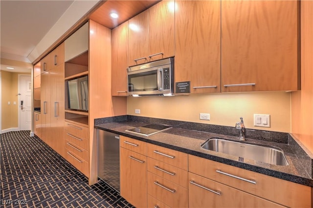 2000 Fashion Show Dr Unit 4105, Las Vegas, NV 89109 - kitchen with stainless steel microwave, black electric stovetop, dark stone counters, modern cabinets, and brick patterned floors