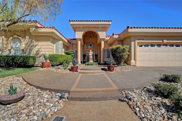 4936 Mountain Foliage Dr, Las Vegas, NV 89148 - mediterranean / spanish house featuring a tiled roof, stucco siding, concrete driveway, and an attached garage