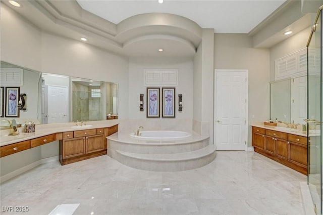 4936 Mountain Foliage Dr, Las Vegas, NV 89148 - bathroom featuring a shower stall, a garden tub, two vanities, recessed lighting, and marble finish floors