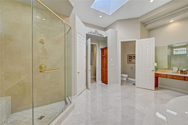 4936 Mountain Foliage Dr, Las Vegas, NV 89148 - full bathroom featuring a stall shower, a skylight, vanity, marble tiled floors, and recessed lighting