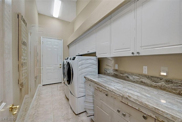 4936 Mountain Foliage Dr, Las Vegas, NV 89148 - laundry area featuring independent washer and dryer, cabinet space, and light tile patterned floors