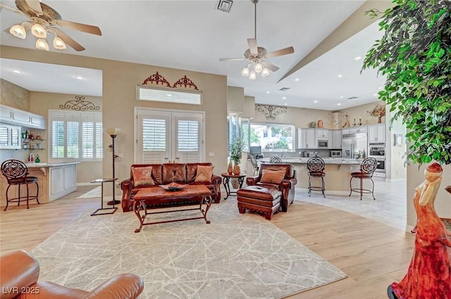 4936 Mountain Foliage Dr, Las Vegas, NV 89148 - living room featuring a ceiling fan, light wood-type flooring, and plenty of natural light