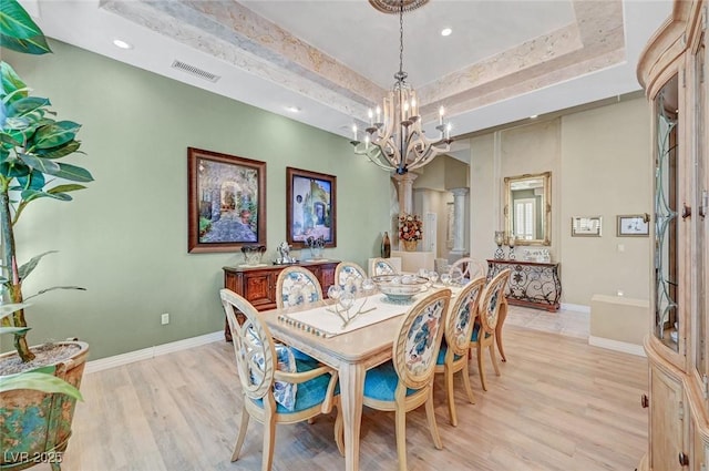 4936 Mountain Foliage Dr, Las Vegas, NV 89148 - dining area featuring a chandelier, light wood-type flooring, a raised ceiling, and recessed lighting