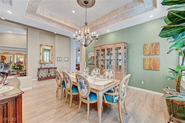 4936 Mountain Foliage Dr, Las Vegas, NV 89148 - dining room with a tray ceiling, a chandelier, light wood-style flooring, and recessed lighting