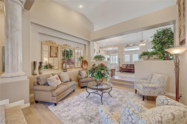 4936 Mountain Foliage Dr, Las Vegas, NV 89148 - living room featuring decorative columns, a ceiling fan, light wood-type flooring, vaulted ceiling, and recessed lighting