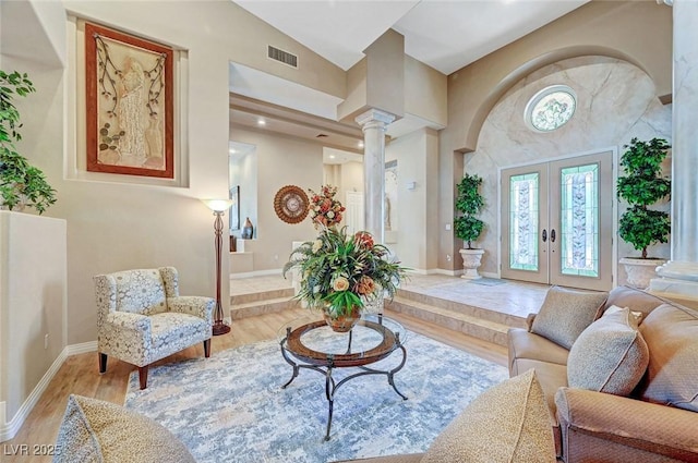 4936 Mountain Foliage Dr, Las Vegas, NV 89148 - living room featuring french doors, ornate columns, and wood finished floors