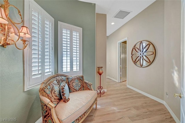 4936 Mountain Foliage Dr, Las Vegas, NV 89148 - living area featuring light wood finished floors and a chandelier