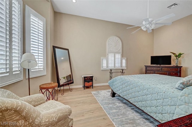 4936 Mountain Foliage Dr, Las Vegas, NV 89148 - bedroom with multiple windows and light wood-type flooring