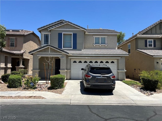 5824 Gemstone Peak St, North Las Vegas, NV 89031 - view of front of property with a garage, concrete driveway, stucco siding, and board and batten siding