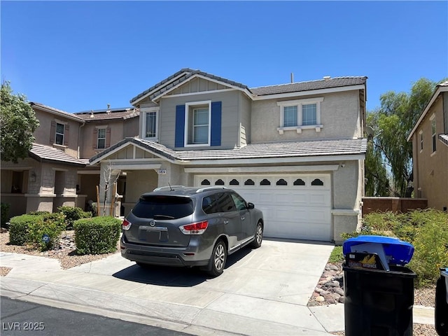 5824 Gemstone Peak St, North Las Vegas, NV 89031 - view of front of home with a garage, driveway, stucco siding, and a tiled roof