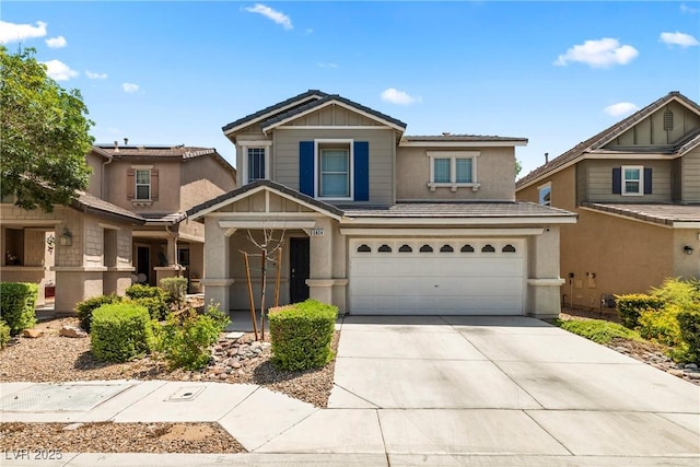 5824 Gemstone Peak St, North Las Vegas, NV 89031 - view of front of home featuring concrete driveway, stucco siding, and an attached garage