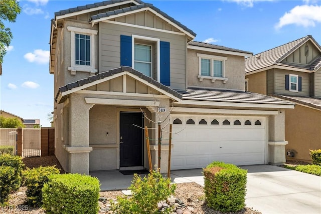 5824 Gemstone Peak St, North Las Vegas, NV 89031 - view of front of property featuring a garage, board and batten siding, and driveway