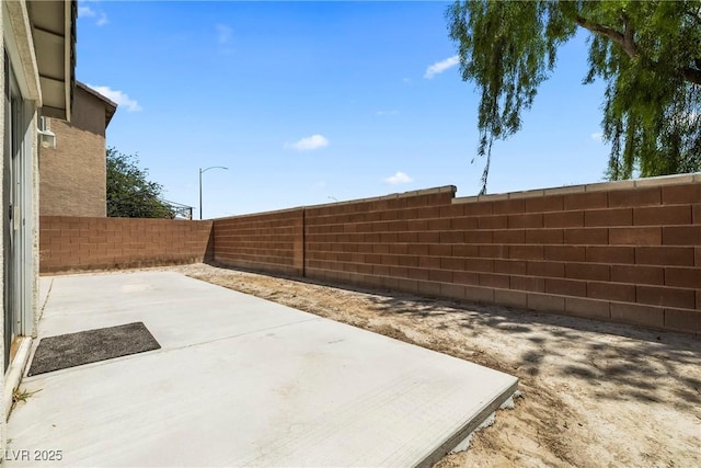 5824 Gemstone Peak St, North Las Vegas, NV 89031 - fenced backyard featuring a patio area
