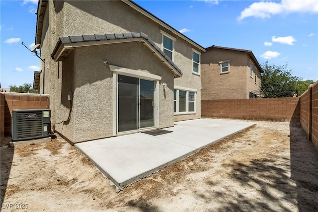 5824 Gemstone Peak St, North Las Vegas, NV 89031 - rear view of house with stucco siding, a patio, and a fenced backyard