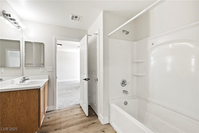5824 Gemstone Peak St, North Las Vegas, NV 89031 - full bathroom featuring bathing tub / shower combination, vanity, and wood finished floors
