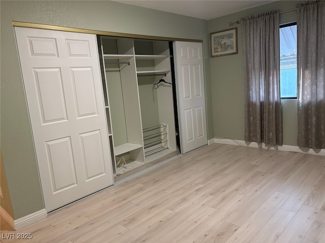 2701 Beaver Creek Ct Unit 201, Las Vegas, NV 89117 - unfurnished bedroom with wood finished floors and a closet