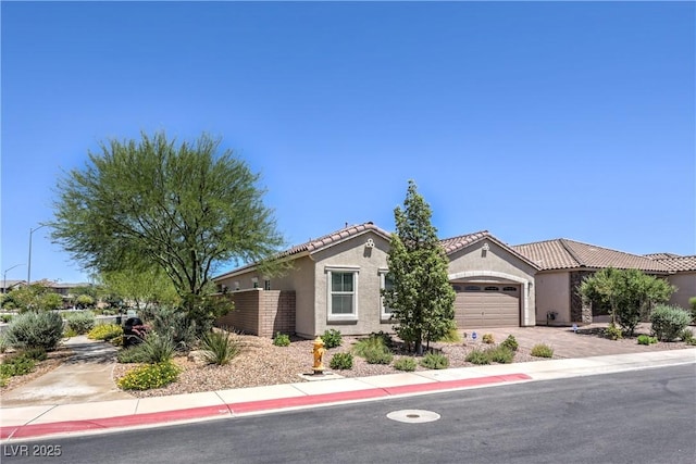 326 Zenith Crest St, Henderson, NV 89015 - view of front of property featuring stucco siding, driveway, an attached garage, and a tile roof