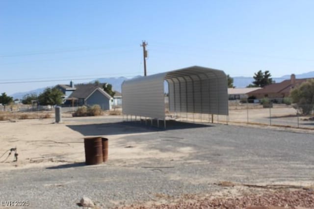 2201 E Dandelion St, Pahrump, NV 89048 - exterior space featuring a detached carport and driveway