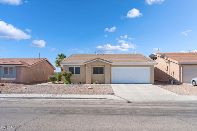 2111 Hollow Oak Ave, North Las Vegas, NV 89031 - ranch-style house with a garage, concrete driveway, and stucco siding