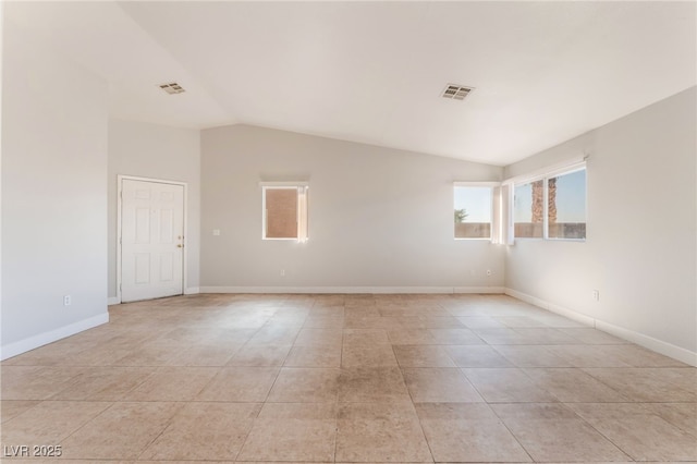 2111 Hollow Oak Ave, North Las Vegas, NV 89031 - unfurnished room with vaulted ceiling and light tile patterned floors