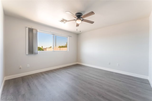 2111 Hollow Oak Ave, North Las Vegas, NV 89031 - spare room with ceiling fan and dark wood-style flooring