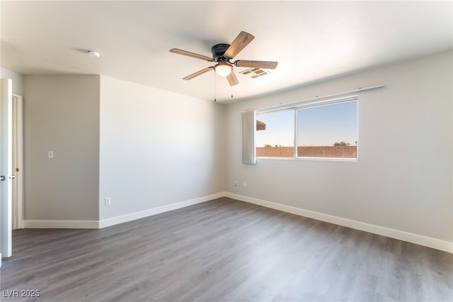 2111 Hollow Oak Ave, North Las Vegas, NV 89031 - empty room with a ceiling fan, wood finished floors, and a smoke detector
