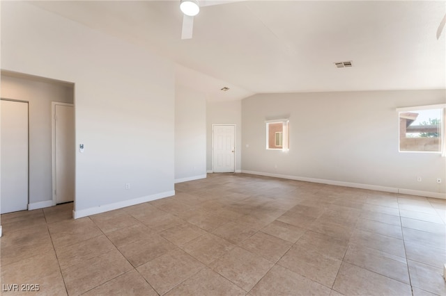 2111 Hollow Oak Ave, North Las Vegas, NV 89031 - unfurnished room with plenty of natural light, lofted ceiling, light tile patterned flooring, and a ceiling fan