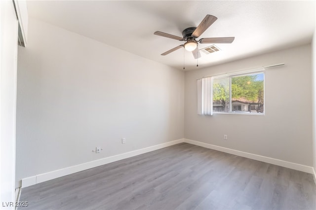 2111 Hollow Oak Ave, North Las Vegas, NV 89031 - spare room with wood finished floors and a ceiling fan