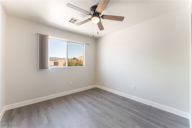 2111 Hollow Oak Ave, North Las Vegas, NV 89031 - spare room featuring ceiling fan and wood finished floors