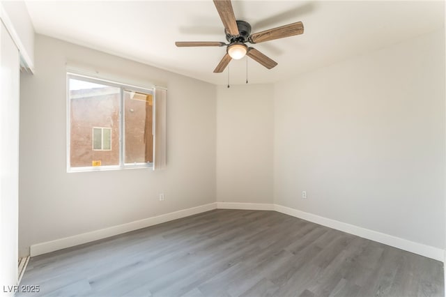 2111 Hollow Oak Ave, North Las Vegas, NV 89031 - spare room with wood finished floors and ceiling fan