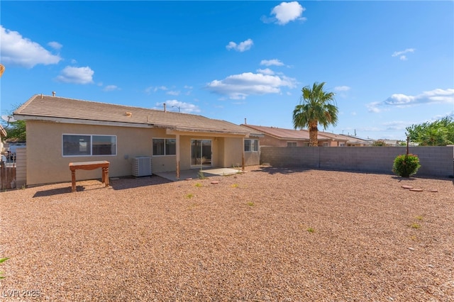 2111 Hollow Oak Ave, North Las Vegas, NV 89031 - rear view of house featuring a fenced backyard, stucco siding, and a patio area