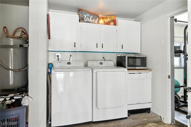 517 5th St, Boulder City, NV 89005 - laundry room featuring washing machine and clothes dryer, cabinet space, and strapped water heater