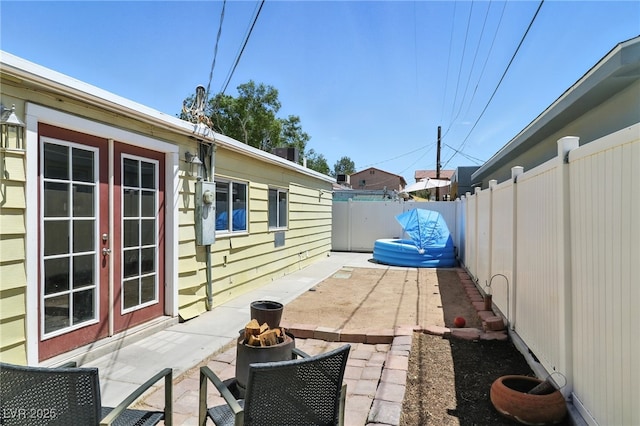 517 5th St, Boulder City, NV 89005 - fenced backyard featuring french doors and a patio area