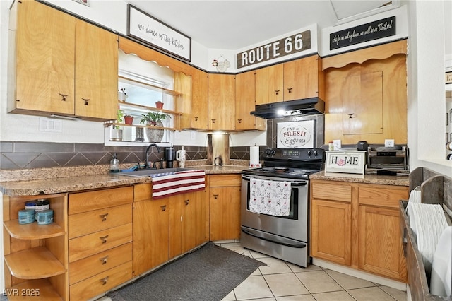 517 5th St, Boulder City, NV 89005 - kitchen with stainless steel electric range, under cabinet range hood, open shelves, light tile patterned flooring, and tasteful backsplash
