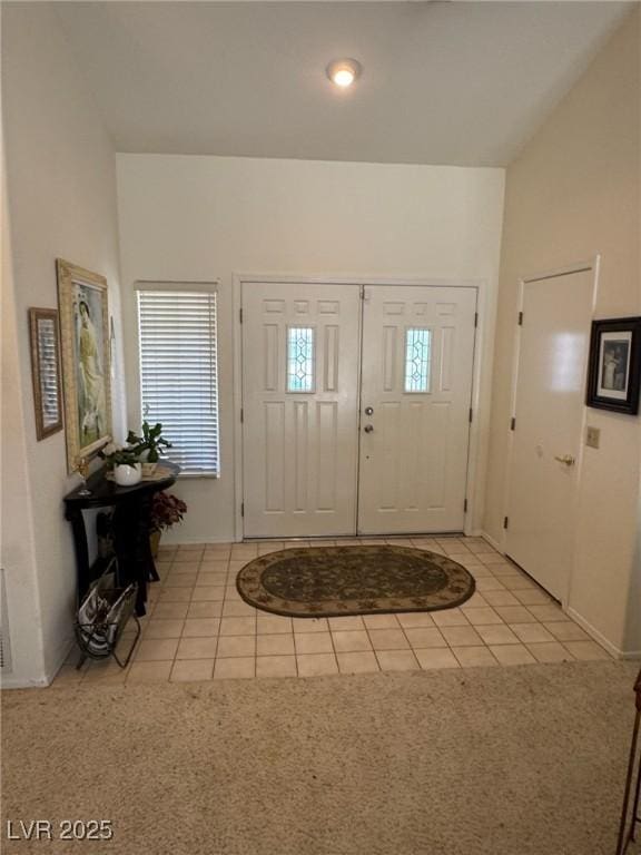 9505 Quail Ridge Dr, Las Vegas, NV 89134 - entrance foyer with light tile patterned floors and light colored carpet