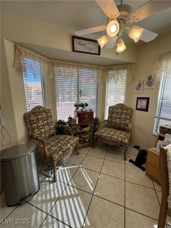 9505 Quail Ridge Dr, Las Vegas, NV 89134 - sitting room featuring light tile patterned floors and a ceiling fan