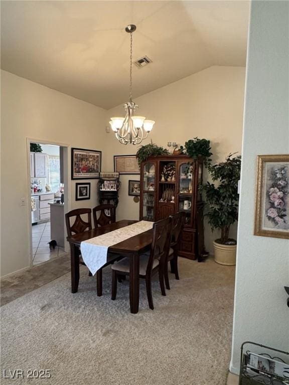 9505 Quail Ridge Dr, Las Vegas, NV 89134 - dining room featuring a chandelier, lofted ceiling, and light colored carpet