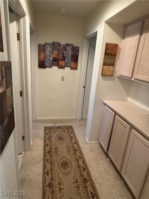 9505 Quail Ridge Dr, Las Vegas, NV 89134 - hallway featuring light colored carpet