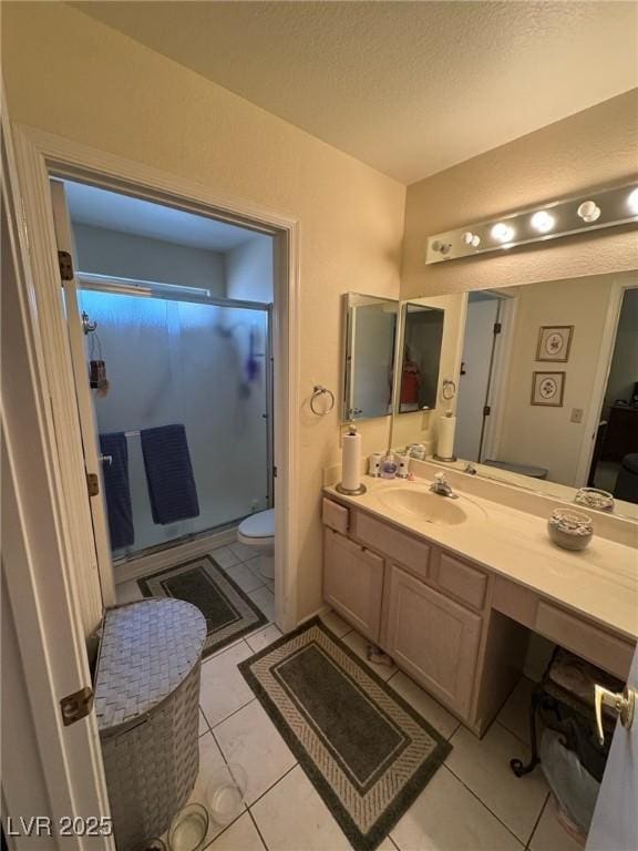9505 Quail Ridge Dr, Las Vegas, NV 89134 - full bathroom featuring a stall shower, vanity, a textured ceiling, and tile patterned floors
