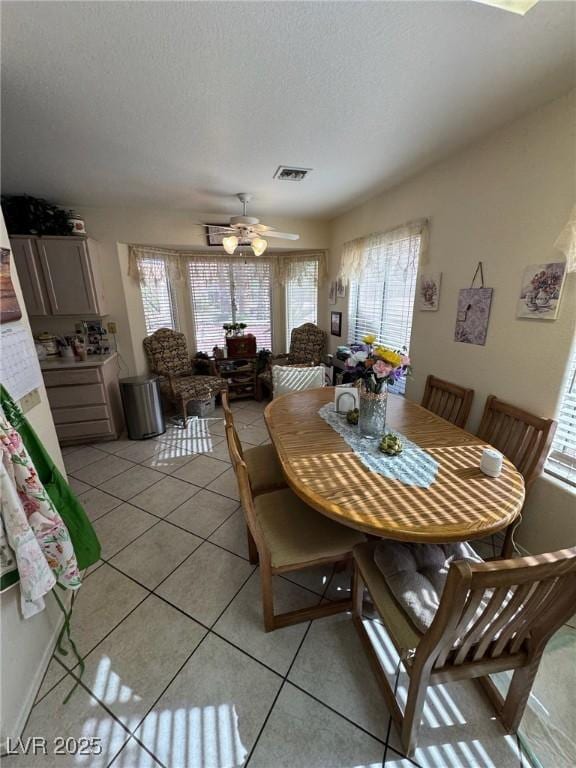 9505 Quail Ridge Dr, Las Vegas, NV 89134 - dining room featuring light tile patterned flooring, ceiling fan, and a textured ceiling