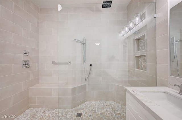 2050 W Warm Springs Rd Unit 4512, Henderson, NV 89014 - full bath featuring tiled shower, vanity, and tile walls