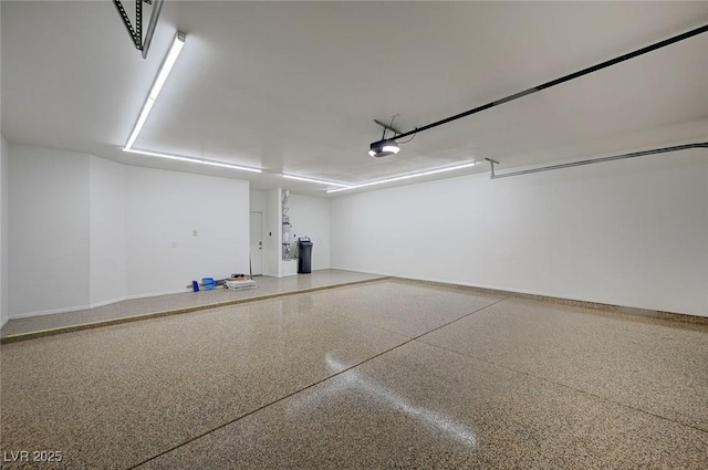 2050 W Warm Springs Rd Unit 4512, Henderson, NV 89014 - garage with a garage door opener and baseboards
